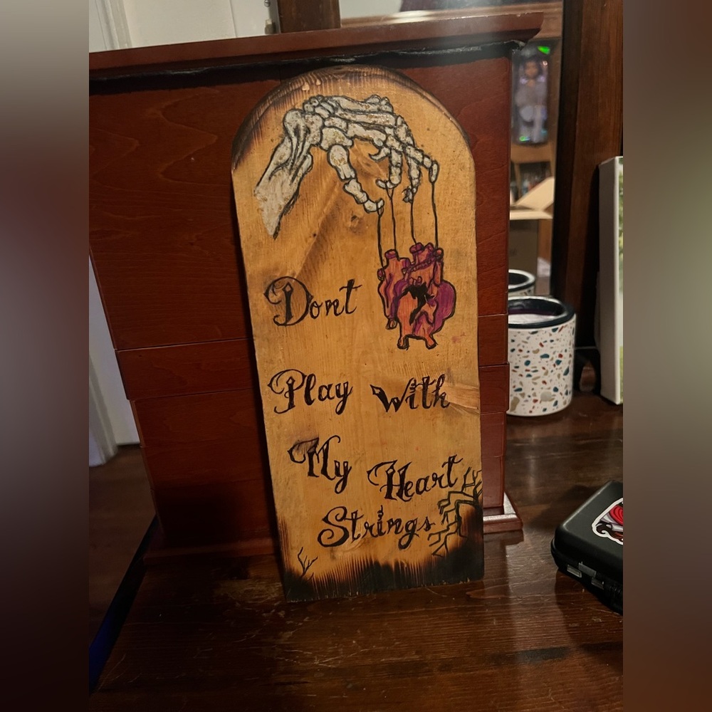 Wooden Plaque with Skeleton Hand and Heart Design